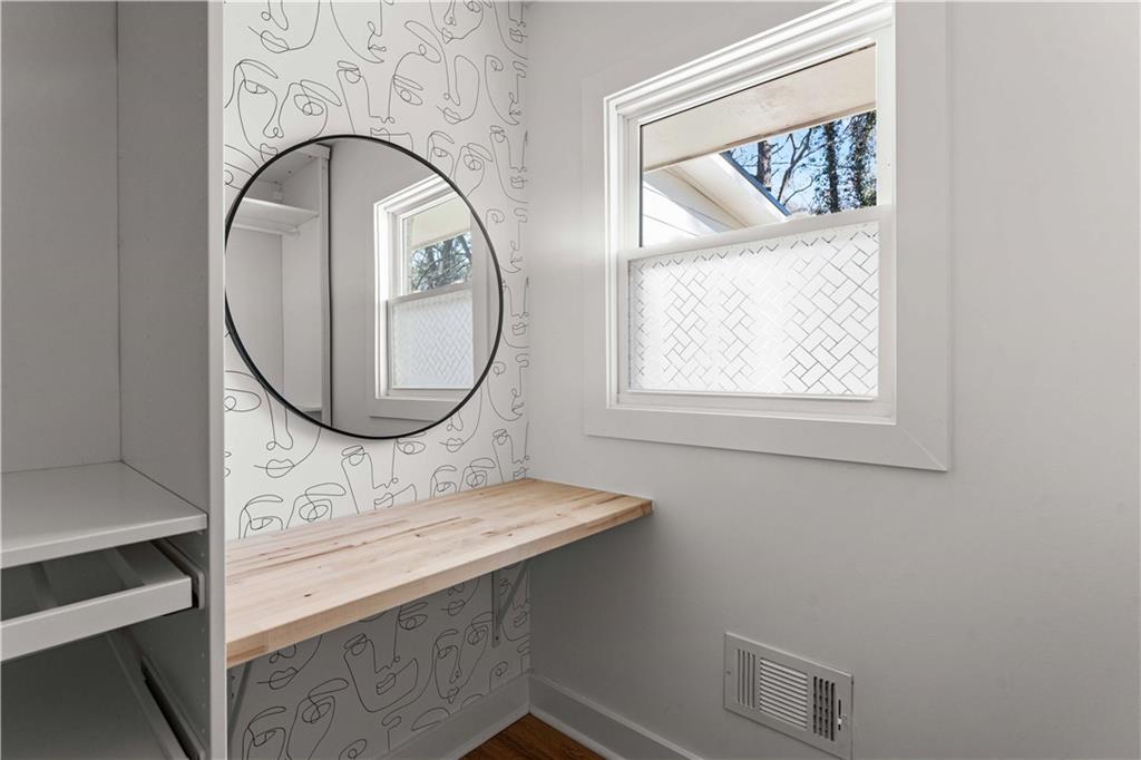 2576 River Oak Drive Decatur, GA 30033 - Photo 19 of 47 a bathroom with a sink a mirror and a window