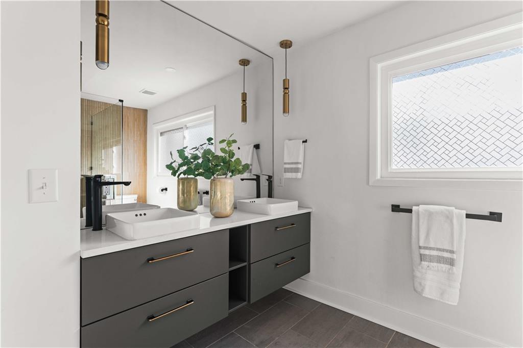 2576 River Oak Drive Decatur, GA 30033 - Photo 20 of 47 a bathroom with a granite countertop sink mirror and double
