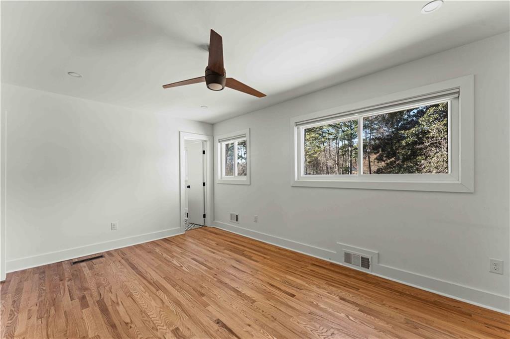 2576 River Oak Drive Decatur, GA 30033 - Photo 23 of 47 a view of empty room with wooden floor and fan