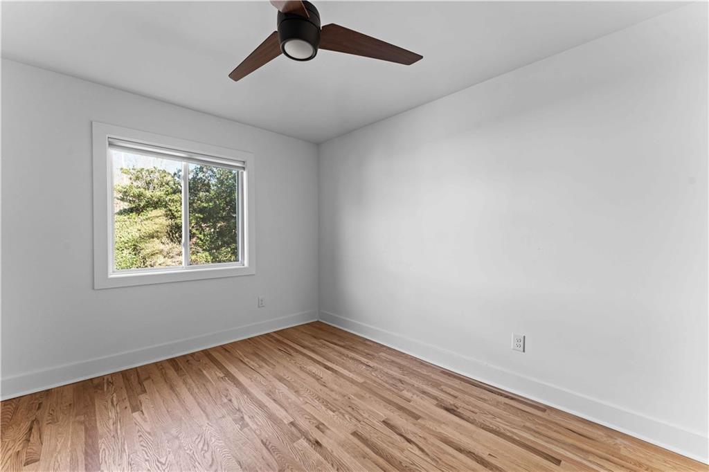 2576 River Oak Drive Decatur, GA 30033 - Photo 26 of 47 a view of empty room with wooden floor and fan