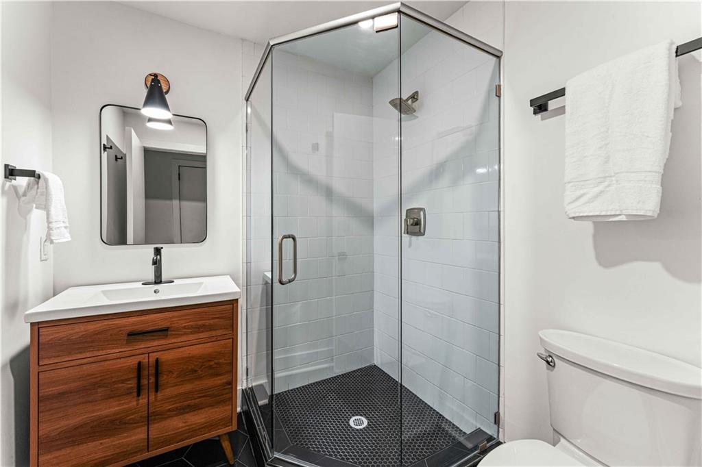 2576 River Oak Drive Decatur, GA 30033 - Photo 27 of 47 a bathroom with a sink a toilet and shower