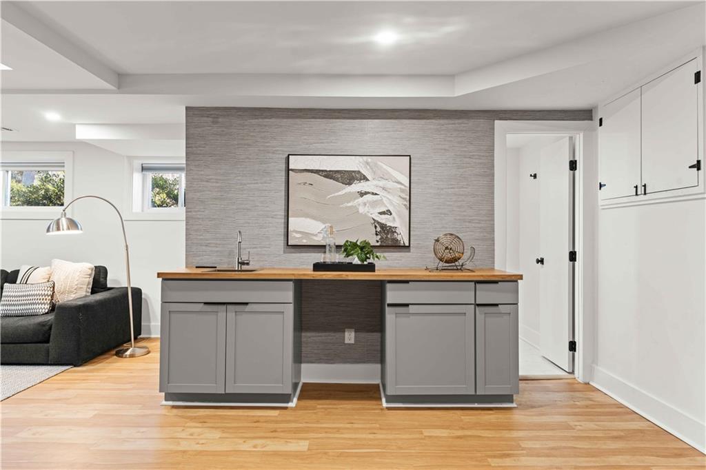 2576 River Oak Drive Decatur, GA 30033 - Photo 33 of 47 a view with granite countertop a sink cabinets and wooden floor
