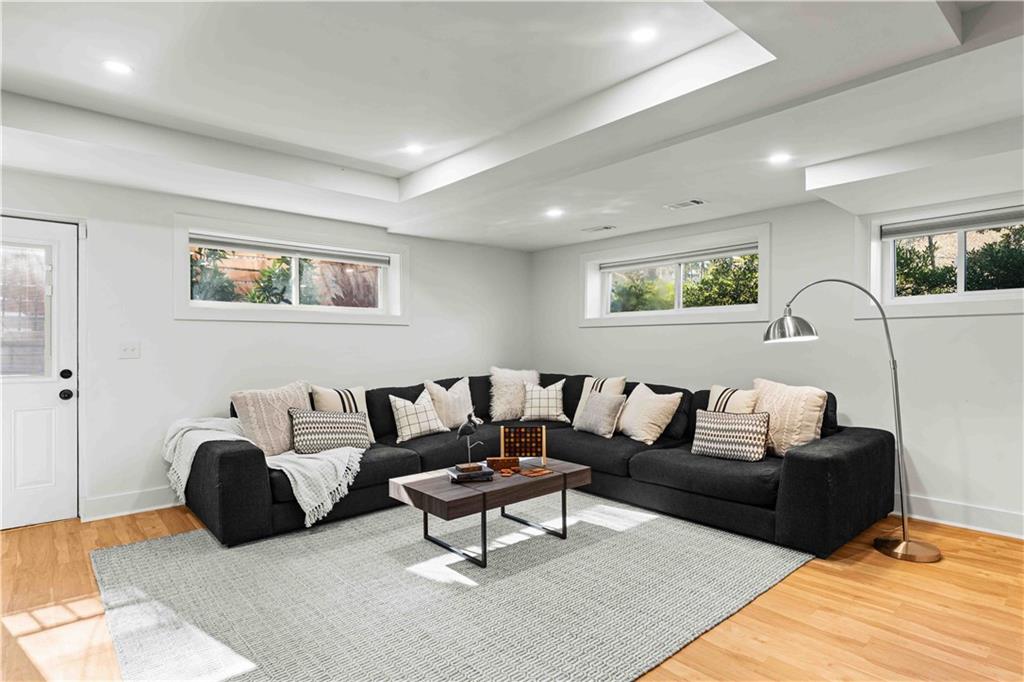 2576 River Oak Drive Decatur, GA 30033 - Photo 34 of 47 a living room with furniture and a wooden floor