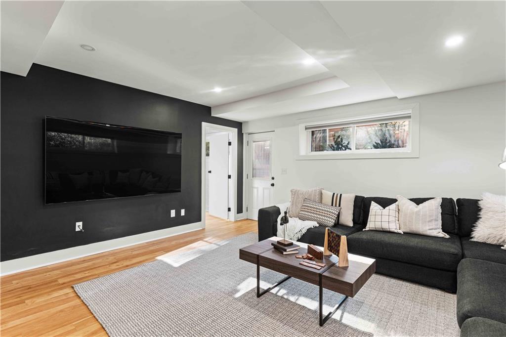 2576 River Oak Drive Decatur, GA 30033 - Photo 35 of 47 a living room with furniture and a flat screen tv