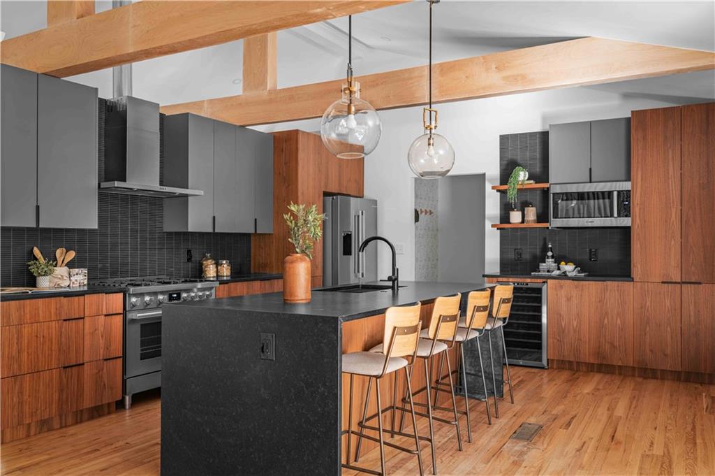 2576 River Oak Drive Decatur, GA 30033 - Photo 5 of 47 a kitchen with stainless steel appliances granite countertop a refrigerator a sink dishwasher a stove and a microwave oven with wooden floor