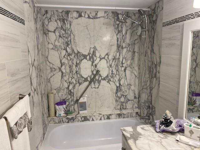 1340 South Ocean Boulevard, Unit 1509 Pompano Beach, FL 33062 - Photo 2 of 14 a bathroom with a bathtub and shower