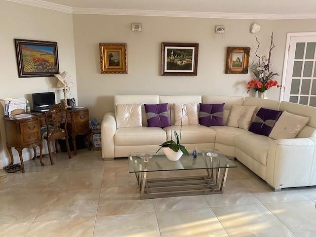 1340 South Ocean Boulevard, Unit 1509 Pompano Beach, FL 33062 - Photo 8 of 14 a living room with furniture and a couch