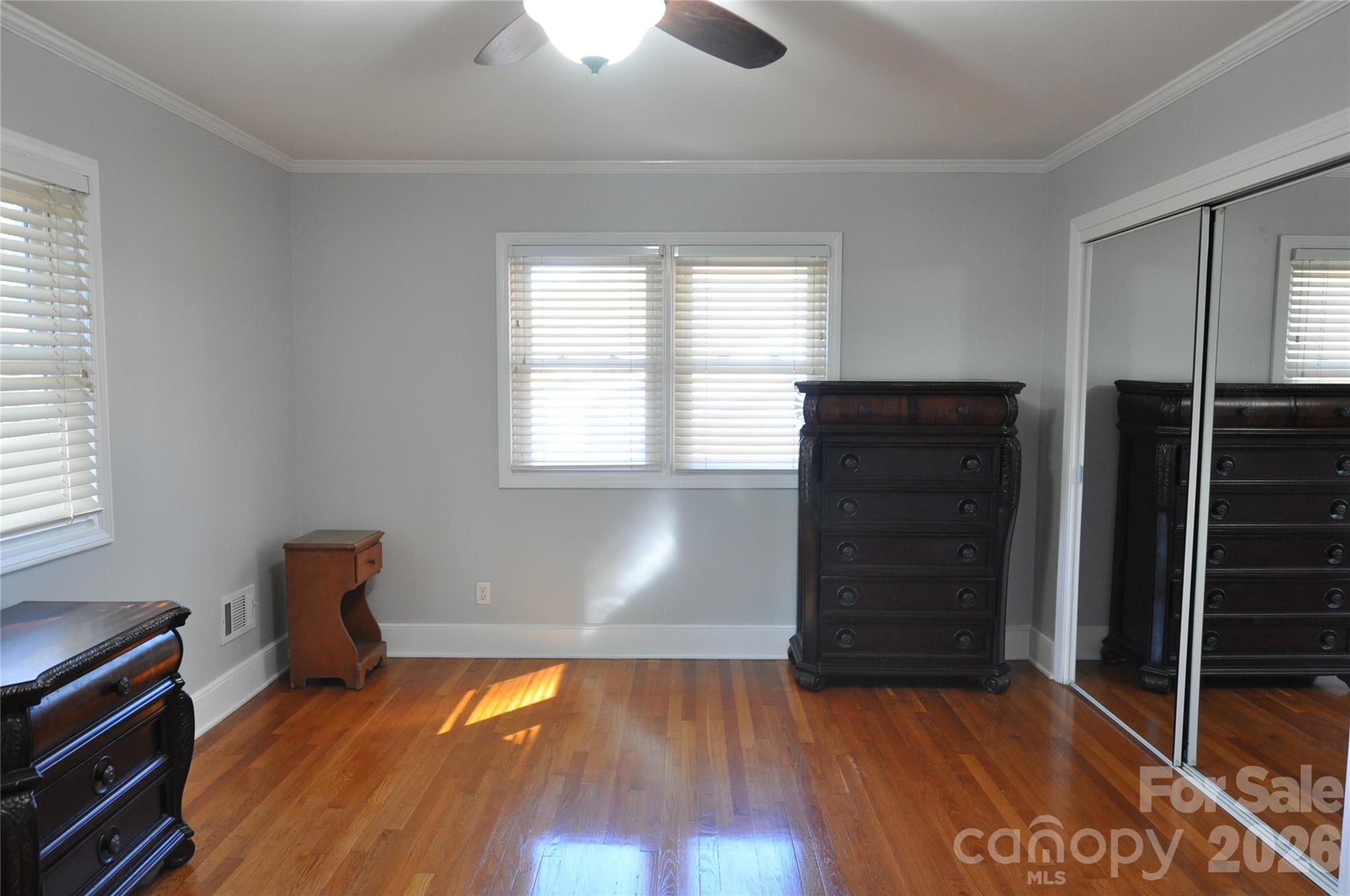 109 Shamrock Drive Chester, SC 29706 - Photo 25 of 38 a room with wooden floor and windows