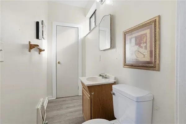 a bathroom with a sink toilet and vanity