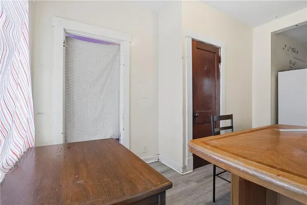 a room with a table and chairs