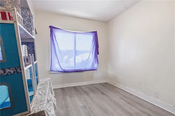 a room with window and a wooden floor