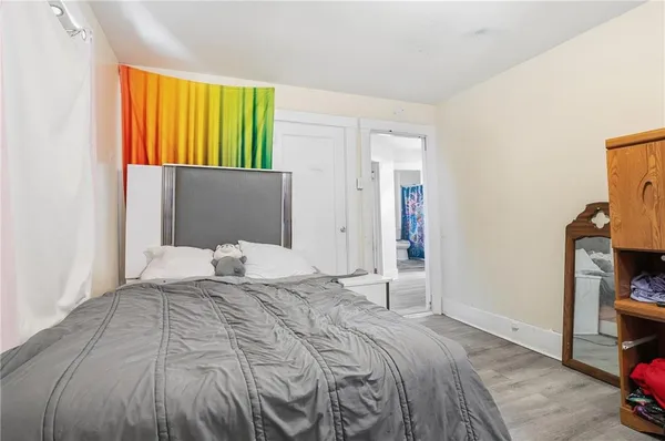 a bedroom with a bed and a tv