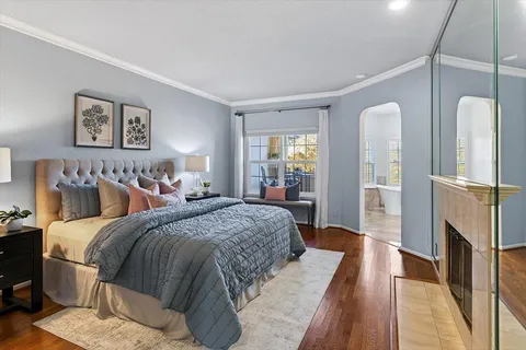 a bed room with a bed and a fireplace