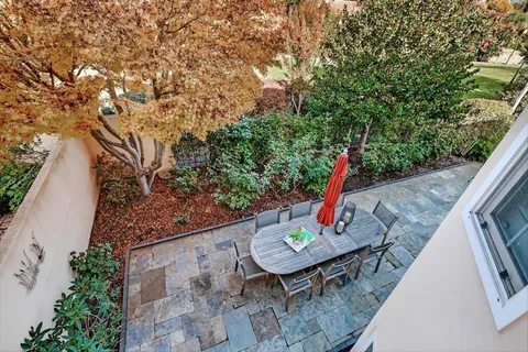 a backyard of a house with outdoor seating