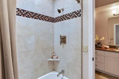a bathroom with a shower toilet and sink