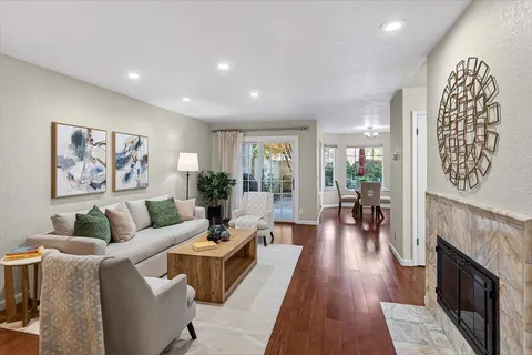 a living room with furniture and a fireplace