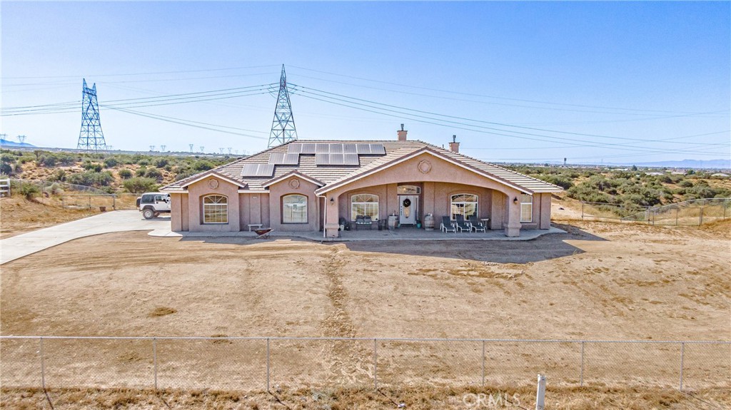 7470 Rodeo Road Oak Hills, CA 92344 - Photo 1 of 1 a front view of a house with a yard