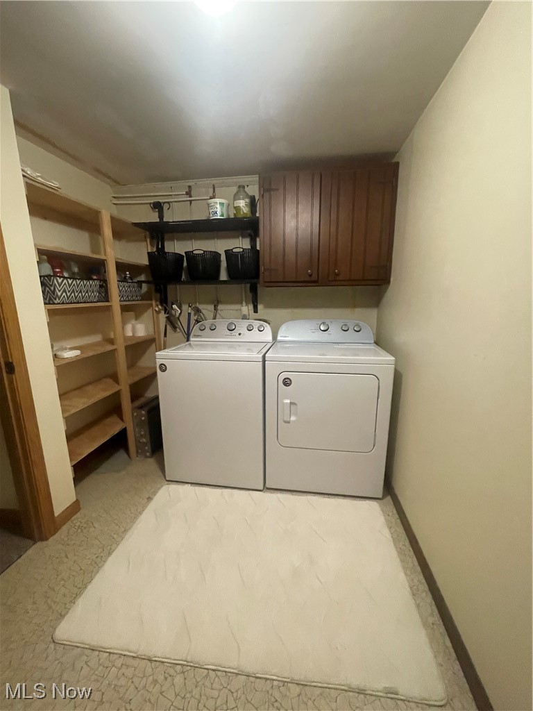 3707 River Road Vienna, WV 26105 - Photo 28 of 35 Clothes washing area with washing machine and dryer and cabinets