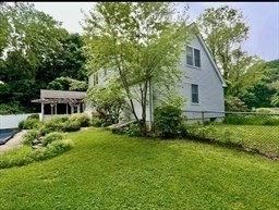178 South Worcester Street Norton, MA 02766 - Photo 12 of 16 a front view of a house with a yard