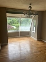 178 South Worcester Street Norton, MA 02766 - Photo 5 of 16 a view of empty room with wooden floor and fan