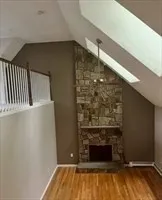 a view of fireplace and wooden floor