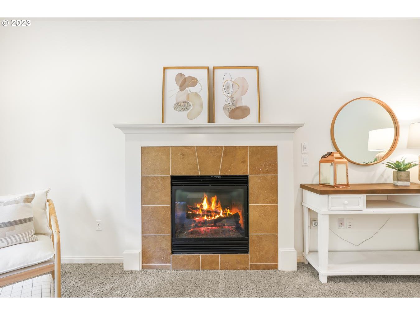 9277 Southwest Rambler Lane Portland, OR 97223 - Photo 13 of 38 a living room with a fireplace and a clock