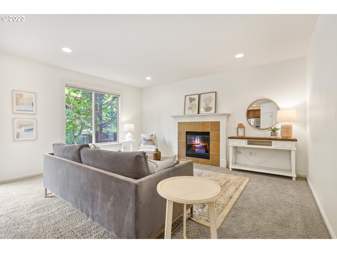 9277 Southwest Rambler Lane Portland, OR 97223 - Photo 14 of 38 a living room with furniture and a fireplace
