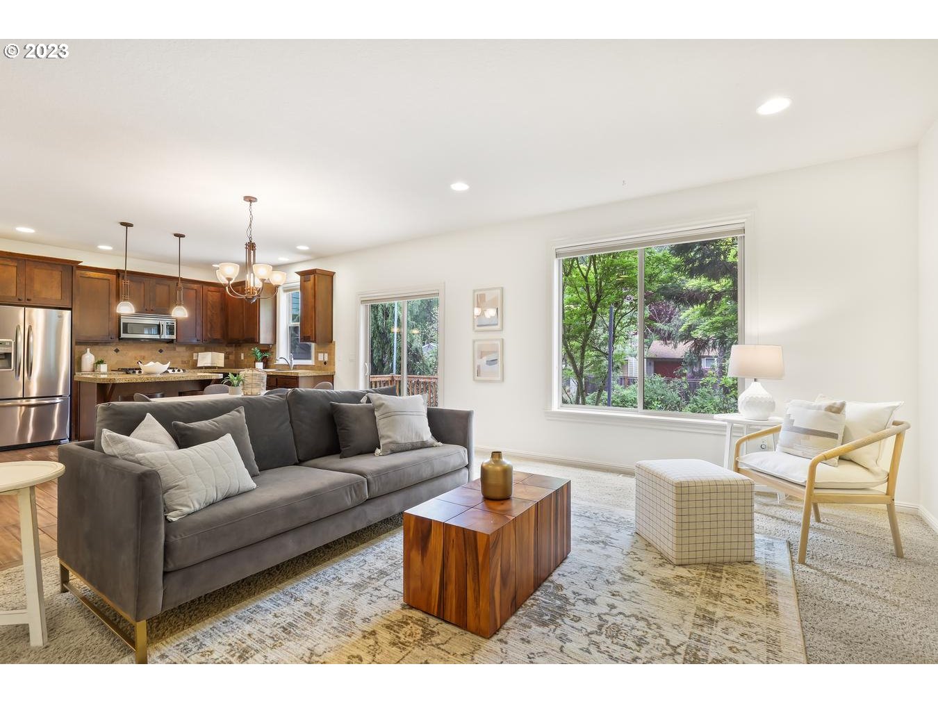 9277 Southwest Rambler Lane Portland, OR 97223 - Photo 15 of 38 a living room with furniture and a large window