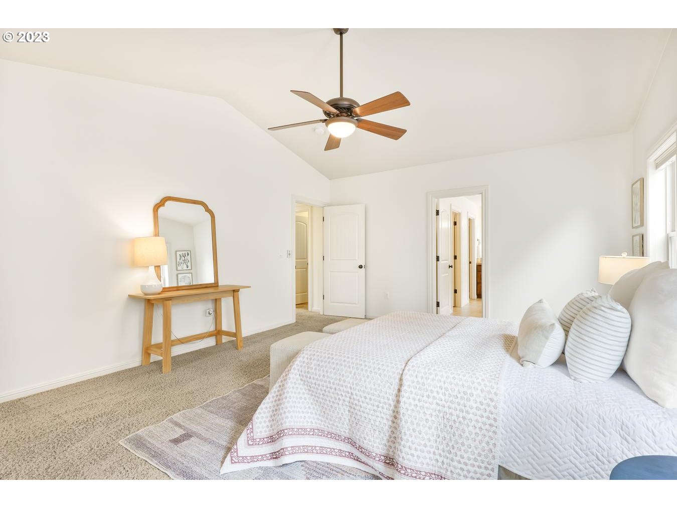 9277 Southwest Rambler Lane Portland, OR 97223 - Photo 26 of 38 a bedroom with a bed chandelier and a window
