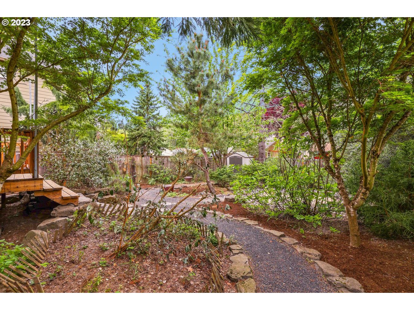 9277 Southwest Rambler Lane Portland, OR 97223 - Photo 30 of 38 a view of a yard with plants and large trees