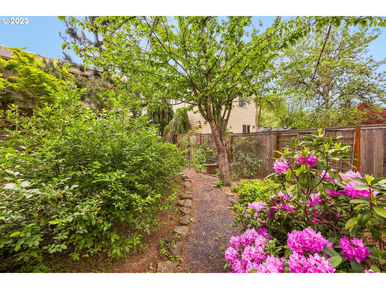 9277 Southwest Rambler Lane Portland, OR 97223 - Photo 33 of 38 a view of yard with flowers and tree