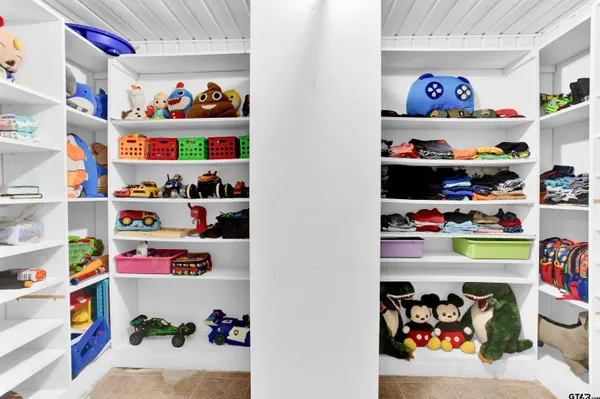 a room with toys and a book shelf