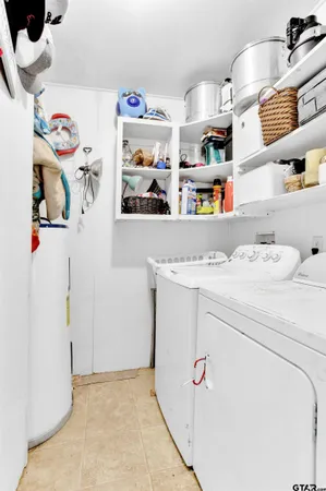 a utility room with storage and utility