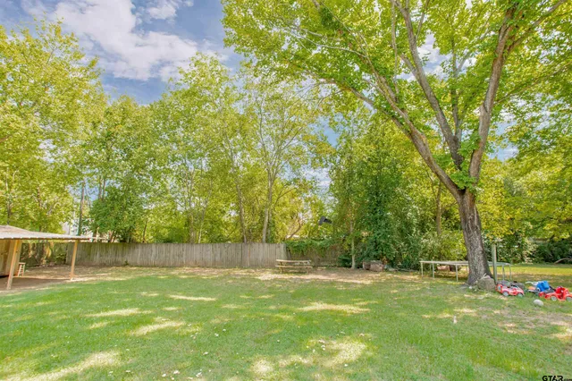 a view of a backyard with a trees