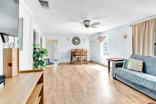 a living room with furniture and a large window