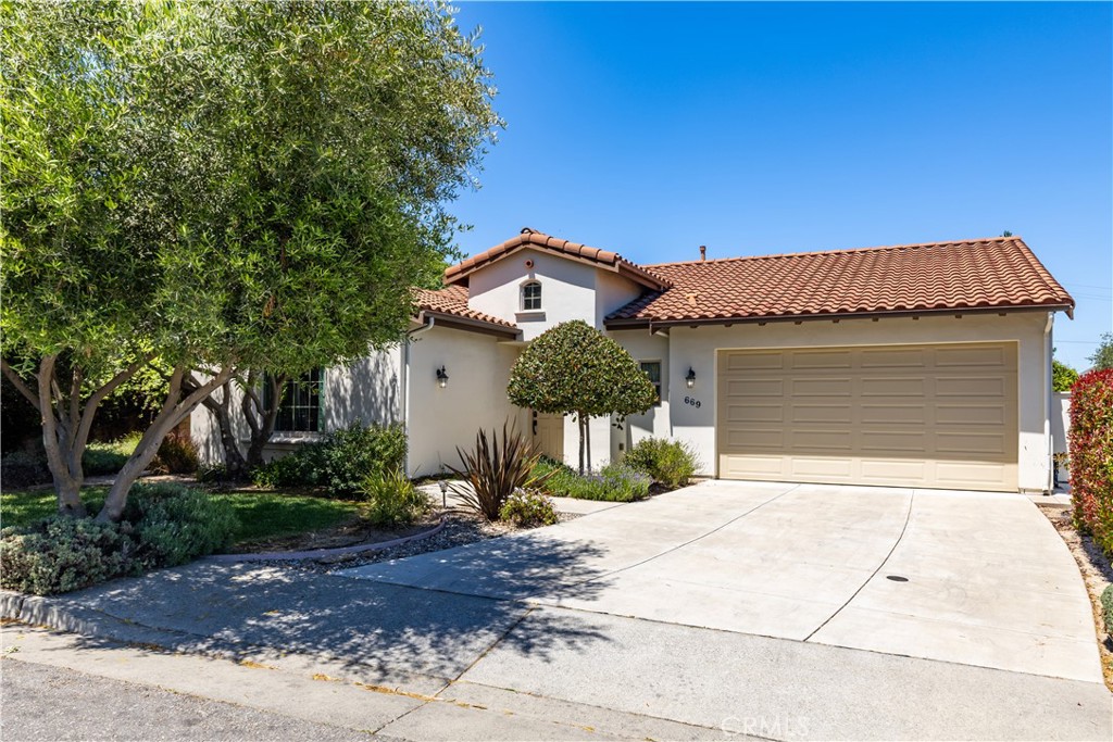 669 Red Cloud Road Paso Robles, CA 93446 - Photo 1 of 61 a front view of a house with a yard and garage