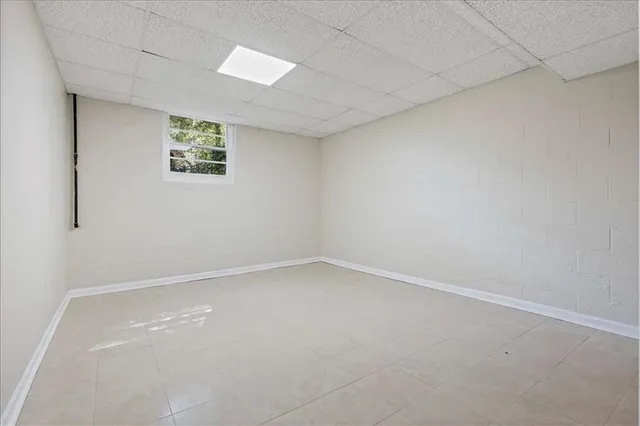 an empty room with a empty space and window
