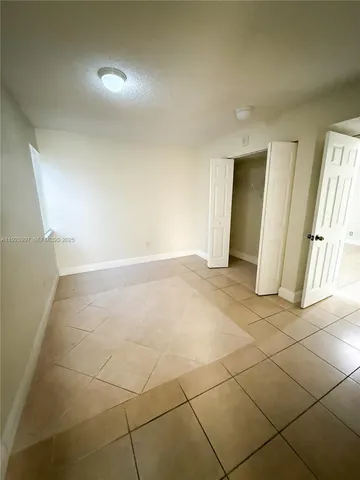 an empty room with a bathroom
