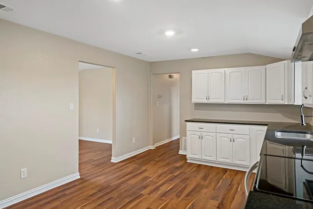 a view of a kitchen with electric appliances