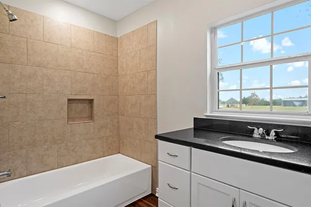 a bathroom with a sink and a bathtub