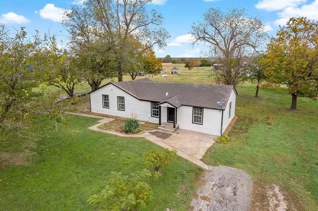 a house view with a garden space