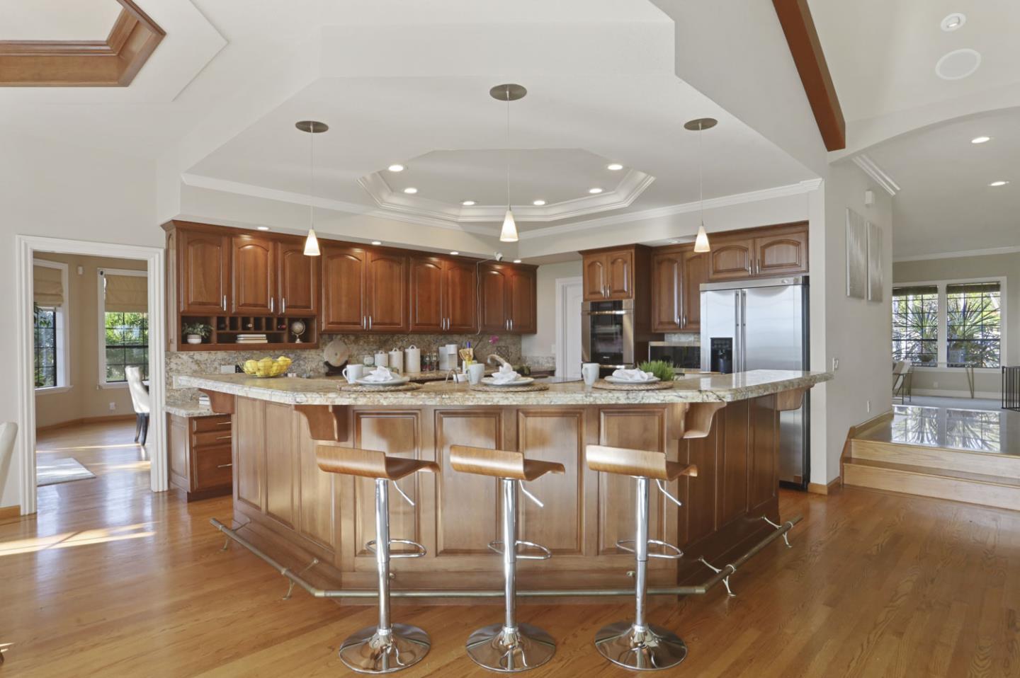 3571 Star Ridge Road Hayward, CA 94542 - Photo 15 of 66 a kitchen with kitchen island granite countertop wooden cabinets and counter space