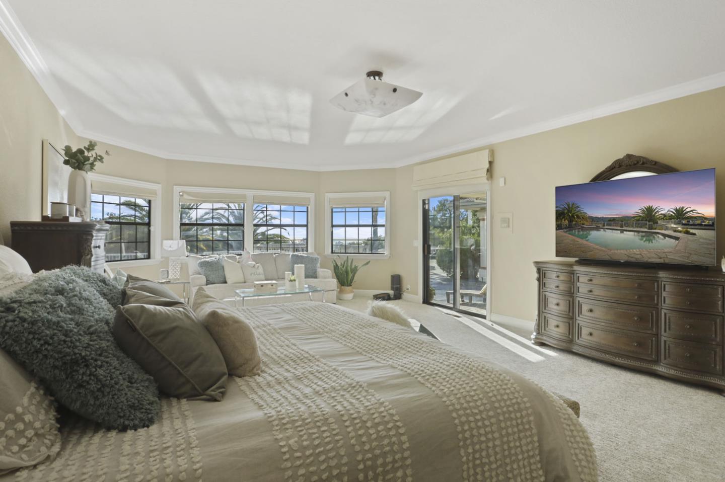3571 Star Ridge Road Hayward, CA 94542 - Photo 24 of 66 a large bedroom with a bed and glass window