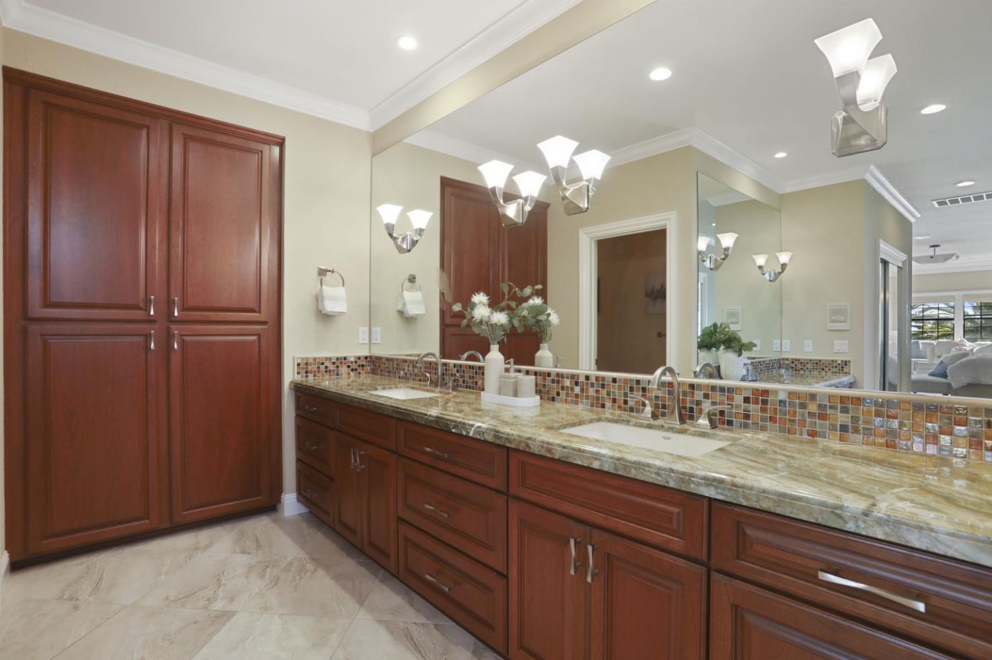 3571 Star Ridge Road Hayward, CA 94542 - Photo 28 of 66 a bathroom with a granite countertop sink and a mirror