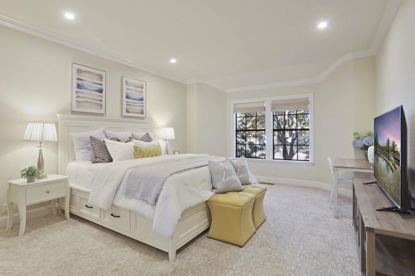 3571 Star Ridge Road Hayward, CA 94542 - Photo 32 of 66 a spacious bedroom with a bed and a flat screen tv