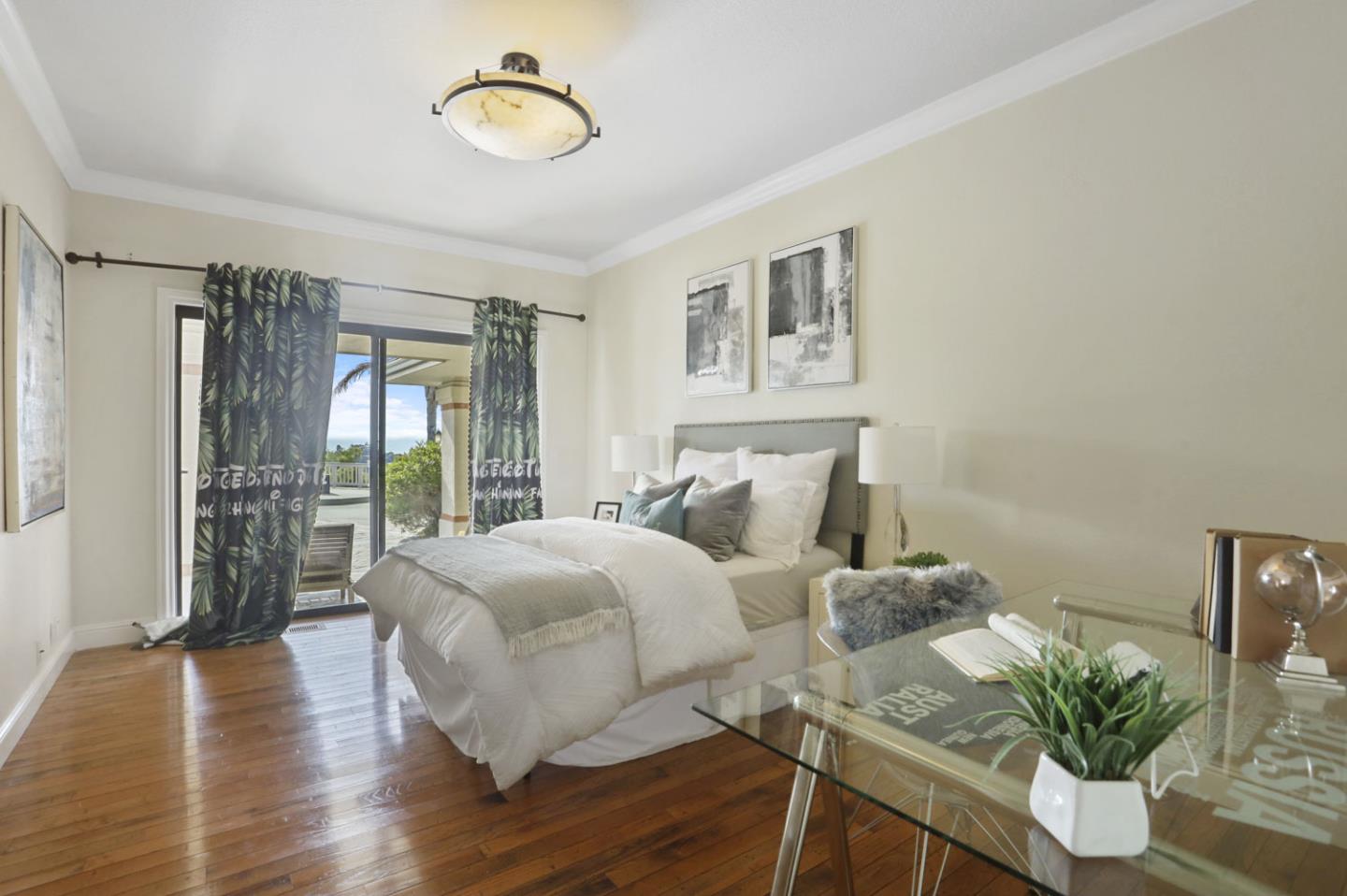 3571 Star Ridge Road Hayward, CA 94542 - Photo 33 of 66 a bedroom with a bed and wooden floor