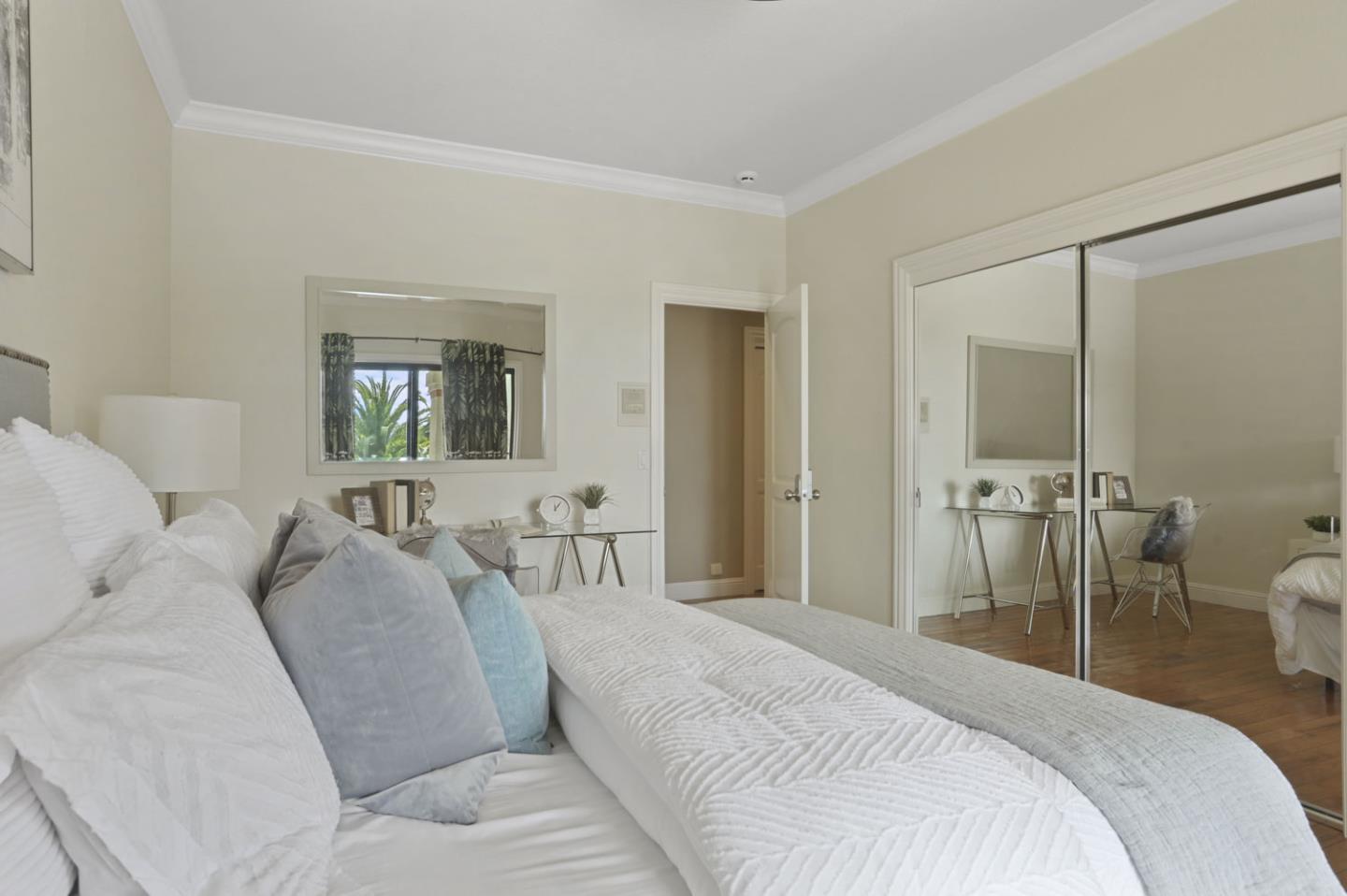 3571 Star Ridge Road Hayward, CA 94542 - Photo 34 of 66 a bedroom with a bed a mirror and a couch