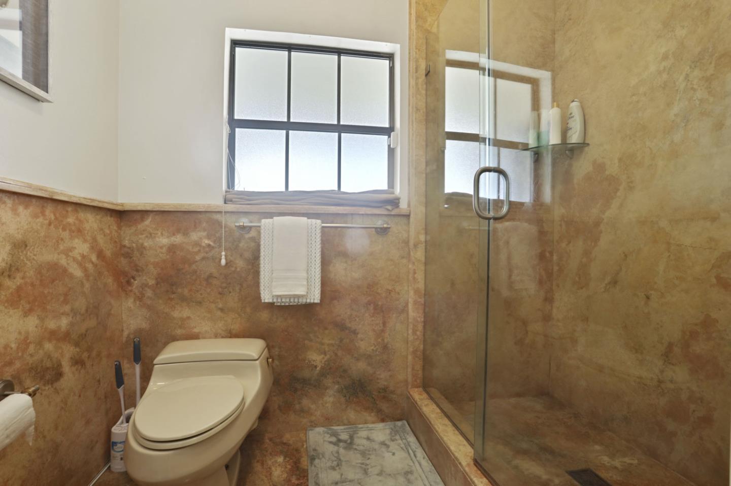 3571 Star Ridge Road Hayward, CA 94542 - Photo 37 of 66 a bathroom with a toilet and a shower