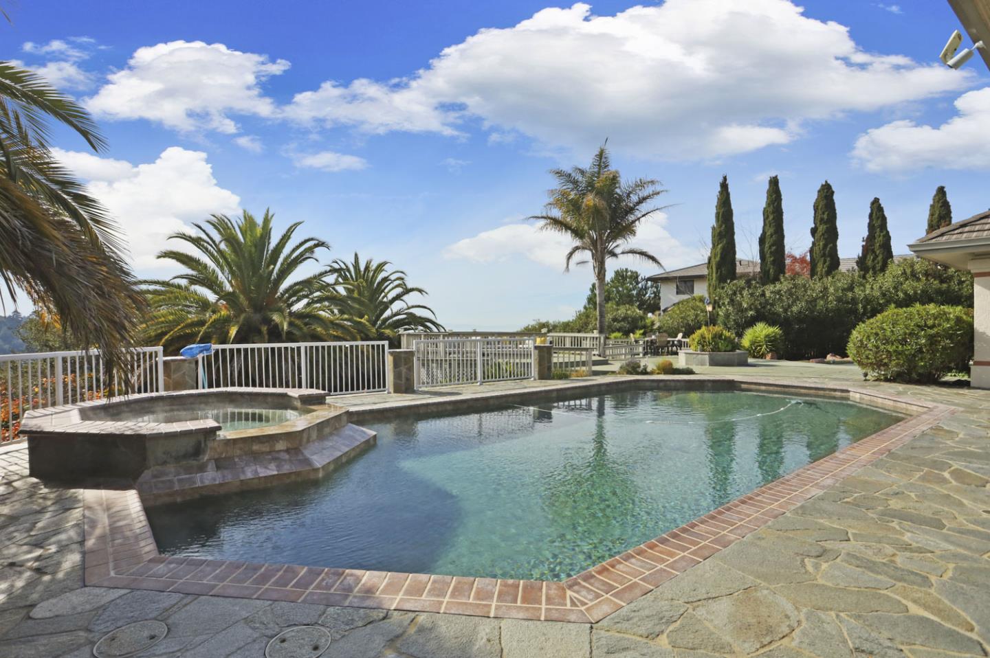 3571 Star Ridge Road Hayward, CA 94542 - Photo 40 of 66 a view of a swimming pool with a table and chairs