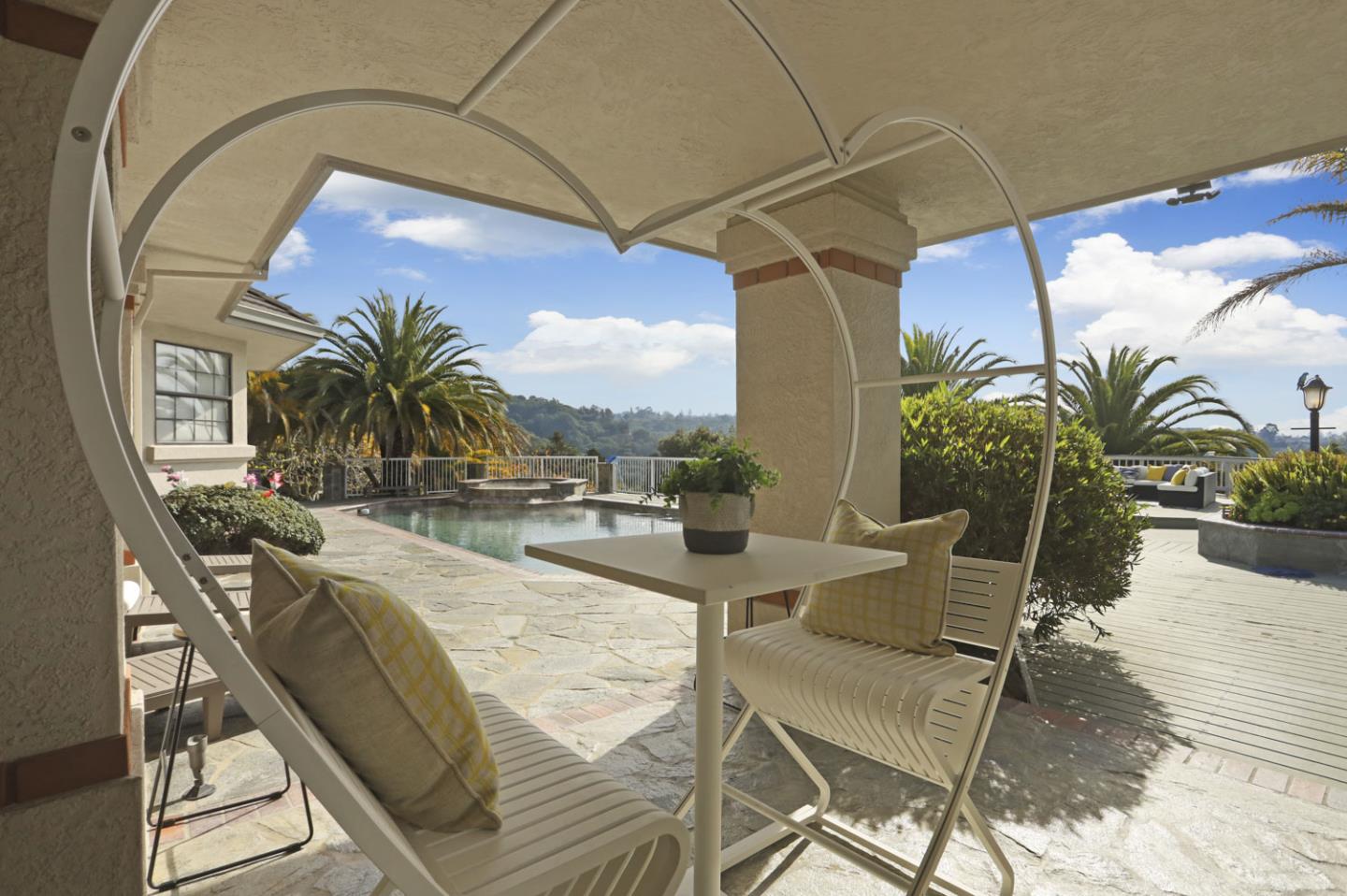 3571 Star Ridge Road Hayward, CA 94542 - Photo 58 of 66 a view of a swimming pool with outdoor seating and a potted plant